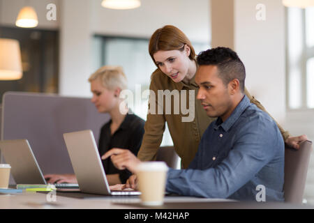 Manager training new employee in office Stock Photo