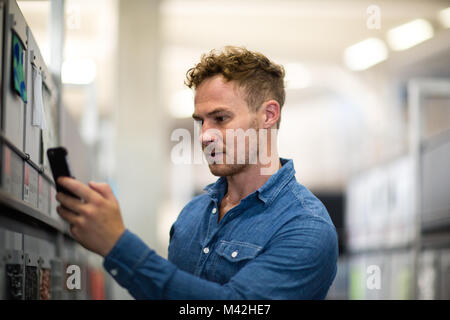 Designer taking photos of samples Stock Photo