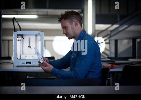Designer with 3D printer Stock Photo