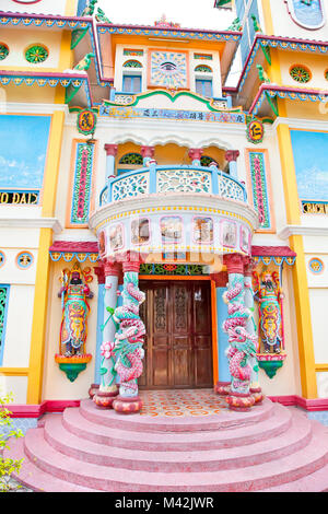 Entrance door of Cao Dai Temple in My Tho village near Saigon city, Long An province, Vietnam. Stock Photo