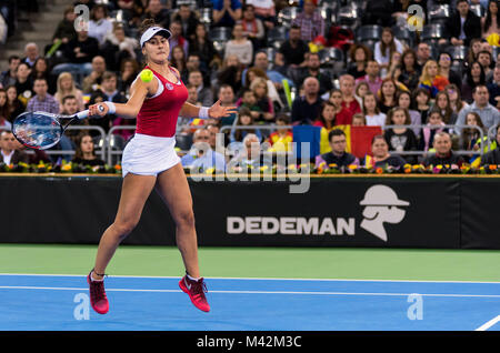 CLUJ NAPOCA, ROMANIA - FEBRUARY 10, 2018: Canadian tennis player Bianca Andreescu plays against Irina Begu from Romania during a Fed Cup match between Stock Photo