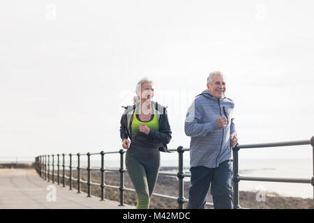 Senior couple jogging together Stock Photo