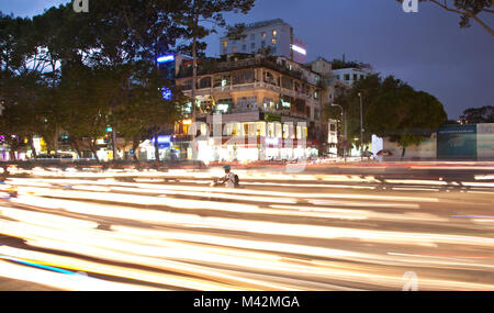 SAIGON - NOV 18, 2013: Road Traffic at evening on Nov 18, 2013 in Saigon (Ho Chi Minh City), Vietnam. Saigon is the largest city in Vietnam. Most popu Stock Photo