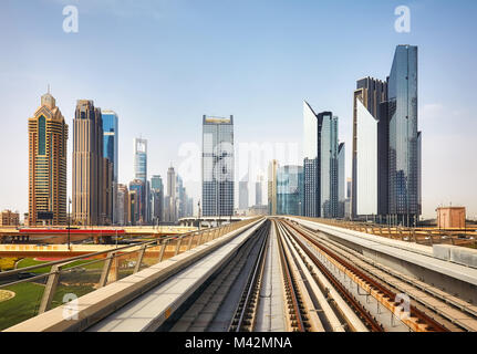 Dubai modern downtown seen from a metro train, United Arab Emirates. Stock Photo