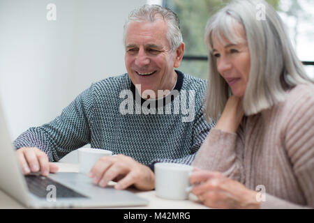 Senior couple using a laptop together Stock Photo
