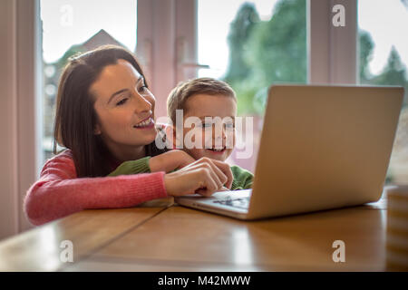 Mother and Son using laptop Stock Photo