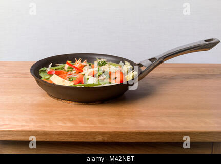 Chinese Style Stir Fry on an oak table top Stock Photo