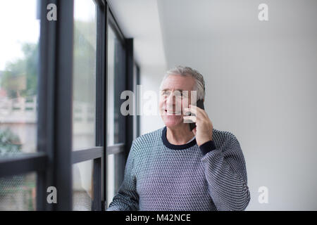 Senior man using smartphone Stock Photo