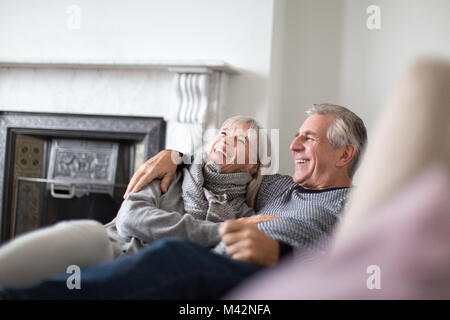 Senior couple relaxing on sofa Stock Photo