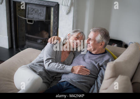 Senior couple relaxing on sofa Stock Photo