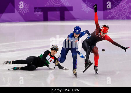 Pyeongchang, South Korea. 13th Feb, 2018. Great Britain's ELISE CHRISTIE (center) crosses the line to win the Ladies Short Track Speed Skating 500m Quarter-Final 2 ahead of Canada's KIM BOUTIN (right) and Hungary's ANDREA KESZLER in third at the Gangneung Oval during day four of the PyeongChang 2018 Winter Olympic Games in South Korea. Credit: Paul Kitagaki Jr./ZUMA Wire/Alamy Live News Stock Photo