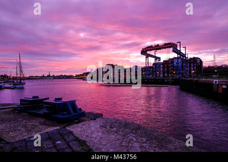Preston, UK. 14th Feb, 2018. UK Weather. There was a stunning sunrise at Preston Marina in Lancashire.  The marina is part of the Albert Dock. The Dock foundation stone was laid in 1885 by Queen Victoria's first son,. Albert Edward the Prince of Wales. The main basin was named after him. Credit: Paul Melling/Alamy Live News Stock Photo