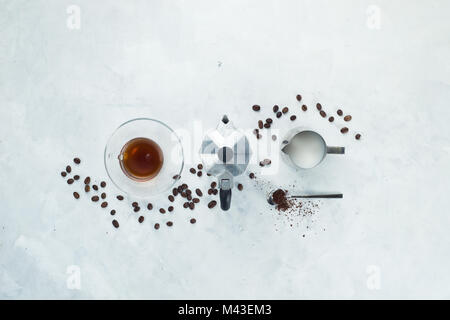 Header with coffee maker minimalist flat lay with coffee beans, milk, ground coffee and geyser coffee maker. Alternative brewing. High key drink photo Stock Photo