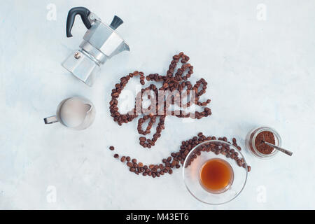 Food lettering concept. Word Coffee made with coffee beans. High key drink photography from above. Food typography. Stock Photo