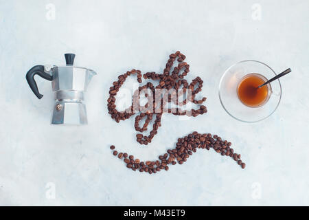 Minimalist flat lay with word Coffee made with coffee beans. Brewing coffee in Moka pot concept. Creative top view hot drink photography with food let Stock Photo
