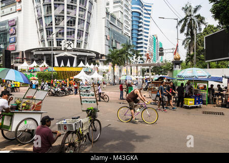 Jakarta, Indonesia - October 27 2017: People enjoy the traffic free streets of Jakarta on every Sunday morning to stroll around and eat street food fr Stock Photo