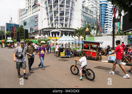 Jakarta, Indonesia - October 27 2017: People enjoy the traffic free streets of Jakarta on every Sunday morning to stroll around and eat street food fr Stock Photo