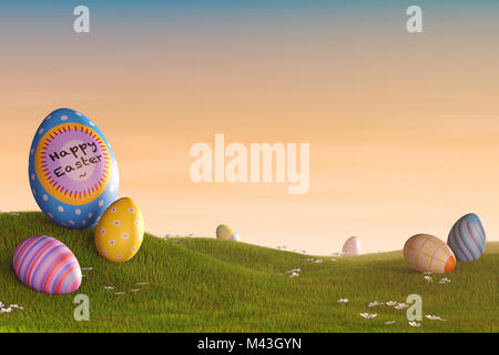 Decorated Easter eggs lying in the grass in a hilly landscape at sunset. Stock Photo