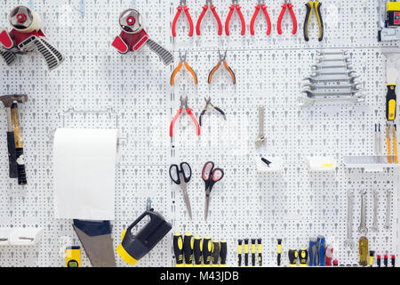 Picture of working tools hanging on board Stock Photo