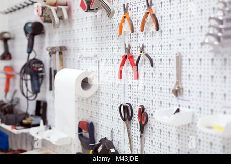 Picture of working tools hanging on board Stock Photo