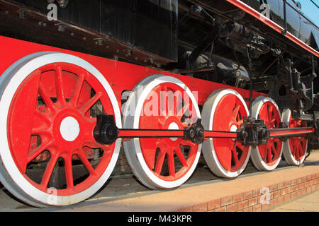 Red wheels of the old express steam train Stock Photo