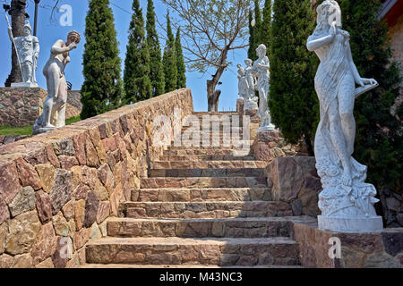 Stone steps with Greek themed statues. Stock Photo