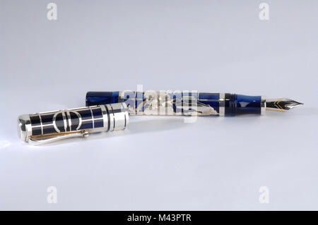 pen for writing lies on a gray background Stock Photo