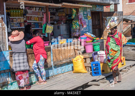 This old lady was waiting after some public transport on a street in  Ambositra, Madagascar, city on the most beautiful road of the country, the  RN7 Stock Photo - Alamy