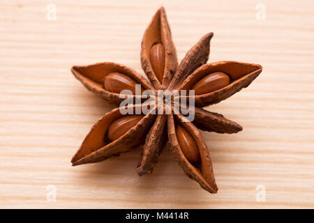 Organic star anise on a wooden table Stock Photo