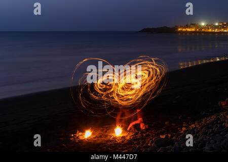 Night shot,fire dance,dance with torches on the beach,La Playa,Valle Gran Rey,La Gomera,Canary Islands,Spain Stock Photo