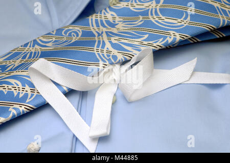 ties of different colors lie on a shirt Stock Photo