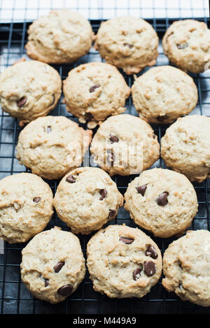 Chocolate chip cookies cooling on rack Stock Photo