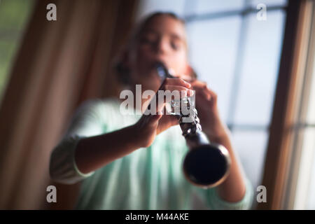 Young clarinettist playing her clarinet Stock Photo