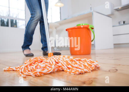 Woman mopping kitchen floor, low section Stock Photo