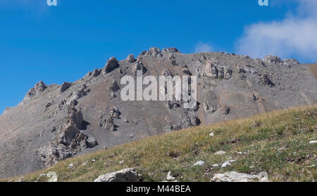 Sharp and dangerous rocks composed of sedimentary rocks Stock Photo