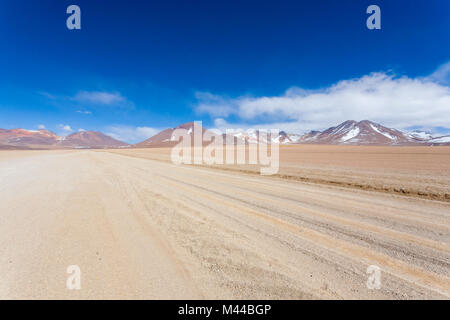 Bolivian dirt road perspective view,Bolivia. Salvador Dali Desert Stock Photo