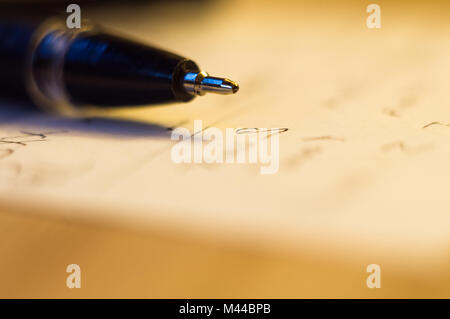 ball point pen and a sheet of paper with the inscription, macro, close up Stock Photo