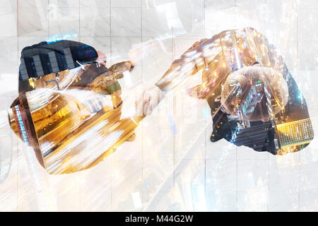 Double exposure of business people shaking hands over busy street background Stock Photo