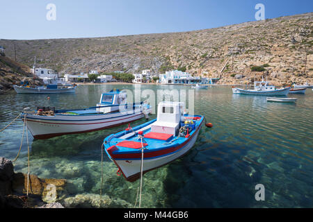 View over clear azure water and fishing boats in harbour, Cheronissos, Sifnos, Cyclades, Aegean Sea, Greek Islands, Greece, Europe Stock Photo