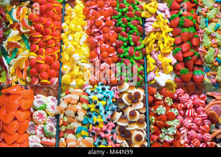 Market stall full of candys at the Boqueria in Bar Stock Photo