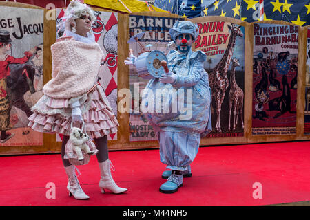 VENICE, ITALY - FEBRUARY 09: People wearing a carnival costume poses during a portrait session on the stage of the circus structure built in Saint Mar Stock Photo