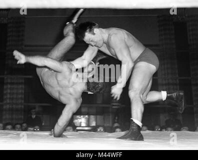 Two grapplers face off in a wrestling match in Chicago, ca. 1950. Stock Photo