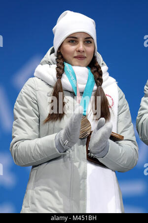 Russian athlete (OAR) Anastasia Bryzgalova receives her Bronze medal for Mixed Doubles Curling during the medal ceremony at the Medal Plaza during day five of the PyeongChang 2018 Winter Olympic Games in South Korea. PRESS ASSOCIATION Photo. Picture date: Wednesday February 14, 2018. See PA story OLYMPICS Curling. Photo credit should read: Mike Egerton/PA Wire. RESTRICTIONS: Editorial use only. No commercial use. Stock Photo