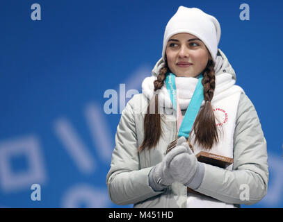 Russian athlete (OAR) Anastasia Bryzgalova receives her Bronze medal for Mixed Doubles Curling during the medal ceremony at the Medal Plaza during day five of the PyeongChang 2018 Winter Olympic Games in South Korea. Stock Photo