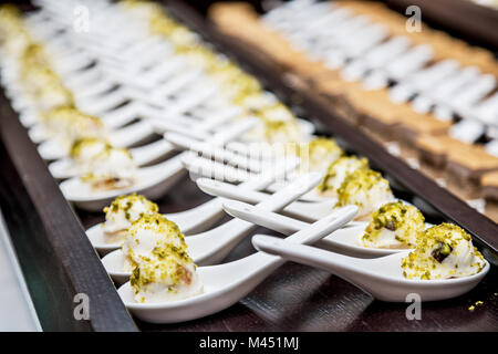 Canapes with mascarpone on banquet table. Stock Photo