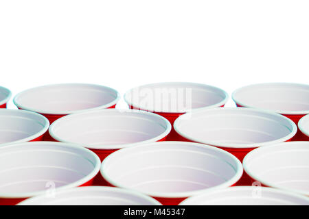 Many red party cups isolated on white. Close up of college alcohol containers with free empty blank copy space for text. Event marketing and promotion Stock Photo