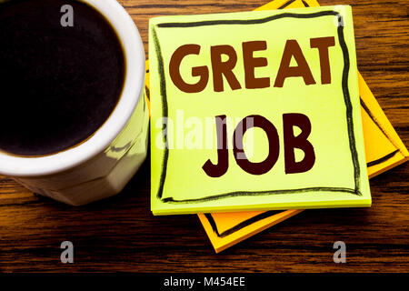 Handwritten text showing Great Job. Business concept for Success Appreciation written on sticky note paper on wooden wood background with coffee cup Stock Photo