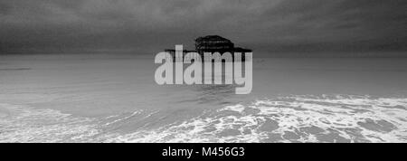 Dramatic skies over the ruined West pier, Brighton & Hove, East Sussex, England, UK Stock Photo