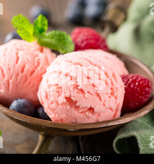 Raspberry ice cream in copper bowl. Stock Photo