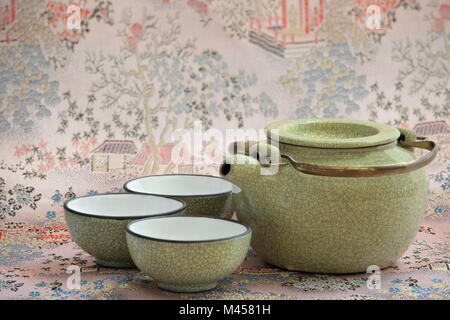 tea ceremony kettle and three cups of tea drinking Stock Photo